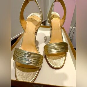 Christian Louboutin heels gold